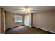 Neutral bedroom with window and ceiling fan at 624 N Lanier Ave, Fort Meade, FL 33841