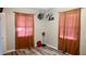 Bedroom with wood-look floors, natural light and western decor at 624 N Lanier Ave, Fort Meade, FL 33841