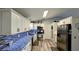 Updated kitchen features stainless steel appliances, granite countertops, and modern backsplash at 624 N Lanier Ave, Fort Meade, FL 33841