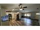 Open concept kitchen with stainless steel appliances and hardwood floors at 624 N Lanier Ave, Fort Meade, FL 33841