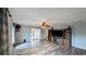 Living room with wood-look floors and a decorative hutch at 624 N Lanier Ave, Fort Meade, FL 33841