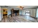 Living room offering wood-look floors and a decorative hutch at 624 N Lanier Ave, Fort Meade, FL 33841