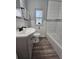 Updated bathroom featuring a modern vanity, white subway tile in the shower, and stylish fixtures at 631 Julia Se St, Winter Haven, FL 33880