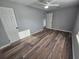 Spacious bedroom with neutral walls, luxury vinyl plank flooring, and ample natural light at 631 Julia Se St, Winter Haven, FL 33880