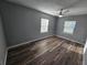 Spacious bedroom with neutral walls, luxury vinyl plank flooring, and ample natural light at 631 Julia Se St, Winter Haven, FL 33880