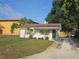 Charming single-story home featuring a brick facade, cozy front yard, and refreshed landscaping at 631 Julia Se St, Winter Haven, FL 33880