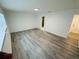 Bright bedroom with hardwood floors and neutral paint, providing a comfortable and stylish space with natural light at 655 E Sanford St, Lake Alfred, FL 33850