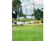This front yard features a well manicured lawn with mature landscaping at 655 E Sanford St, Lake Alfred, FL 33850