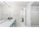 Bathroom featuring a white countertop, seafoam green cabinets, with an additional storage room at 703 Magnolia Pl # 703, Winter Haven, FL 33884