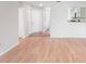 Foyer area leading into the home with wood floors and sightlines to kitchen at 703 Magnolia Pl # 703, Winter Haven, FL 33884