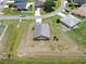 Aerial shot showing the home's fenced-in back yard and surrounding neighborhood at 830 Cabaret Ct, Kissimmee, FL 34759