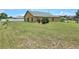 Spacious backyard with ample green space at 830 Cabaret Ct, Kissimmee, FL 34759