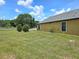 Lush backyard featuring a well-manicured lawn at 830 Cabaret Ct, Kissimmee, FL 34759