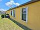 Exterior detail showing windows and siding at 830 Cabaret Ct, Kissimmee, FL 34759