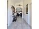 Elegant foyer with tile flooring and decorative details; access to the living room at 830 Cabaret Ct, Kissimmee, FL 34759
