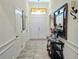 Bright, tile-floored foyer with elegant decor and easy access to the living spaces at 830 Cabaret Ct, Kissimmee, FL 34759