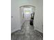 Spacious foyer featuring tiled floors and a view towards the home's entrance at 830 Cabaret Ct, Kissimmee, FL 34759