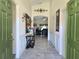 Warm entryway with ceramic tile and decorative accents that leads to the living area at 830 Cabaret Ct, Kissimmee, FL 34759