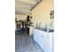 Garage area with cabinets, sink, and tools neatly organized at 830 Cabaret Ct, Kissimmee, FL 34759