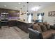 Modern kitchen with dark cabinets, granite countertops, and stainless steel appliances at 830 Cabaret Ct, Kissimmee, FL 34759