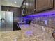 Kitchen featuring granite countertops, stainless steel appliances, and accent lighting at 830 Cabaret Ct, Kissimmee, FL 34759