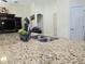 Kitchen sink featuring granite countertops, a chrome faucet, and elegant accents at 830 Cabaret Ct, Kissimmee, FL 34759