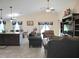 Expansive living area with vaulted ceilings and view into the dining area and kitchen at 830 Cabaret Ct, Kissimmee, FL 34759