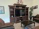 Living room with a large entertainment center, perfect for Gathering gatherings at 830 Cabaret Ct, Kissimmee, FL 34759