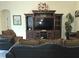 Living room showcasing a large entertainment center and comfortable seating at 830 Cabaret Ct, Kissimmee, FL 34759