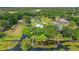Aerial view showcasing the home, waterfront access, and lush green surroundings at 8314 W Lake Marion Rd, Haines City, FL 33844