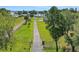 An aerial view of the property shows a long driveway leading to the home at 8314 W Lake Marion Rd, Haines City, FL 33844