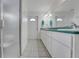 Bathroom with long vanity, sink, mirrors, and walk-in shower at 8314 W Lake Marion Rd, Haines City, FL 33844