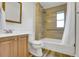 Well lit bathroom offers shower and tub combination and wood-look flooring at 8314 W Lake Marion Rd, Haines City, FL 33844