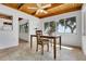 Sunlit dining area featuring a wood table, chairs, and scenic outdoor views at 8314 W Lake Marion Rd, Haines City, FL 33844