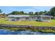 Rear view of a home featuring waterfront access with private docking at 8314 W Lake Marion Rd, Haines City, FL 33844