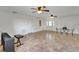 Bright living room with tile flooring, fans, piano, and decorative doors at 8314 W Lake Marion Rd, Haines City, FL 33844