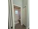 Bathroom with a tub and shower combination, complemented by a practical storage closet and a neutral color scheme at 832 Vienna Dr, Winter Haven, FL 33884