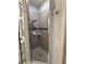 The bathroom's shower features gray tile with black accents and a frameless glass enclosure at 832 Vienna Dr, Winter Haven, FL 33884
