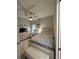 Comfortable bedroom with a large bed, dresser, and bench with light and neutral tones throughout at 832 Vienna Dr, Winter Haven, FL 33884
