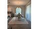 Bright dining area with large window for natural light and stylish table with seating at 832 Vienna Dr, Winter Haven, FL 33884