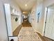 Elegant hallway with a built-in coat rack and wood-style floors at 832 Vienna Dr, Winter Haven, FL 33884
