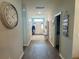 Inviting hallway with coat storage and a view of the front door at 832 Vienna Dr, Winter Haven, FL 33884