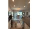 Modern kitchen with granite countertops and stainless steel appliances overlooks the dining area at 832 Vienna Dr, Winter Haven, FL 33884