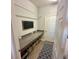 This laundry room features a long countertop with storage underneath at 832 Vienna Dr, Winter Haven, FL 33884