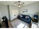 Cozy living room featuring a plush blue sofa and modern decor for comfortable living at 832 Vienna Dr, Winter Haven, FL 33884