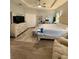 This main bedroom is spacious and bright featuring light-colored walls, a large window, and wood-look floors at 832 Vienna Dr, Winter Haven, FL 33884