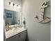 Nautical-themed powder room with maritime decor, including a decorative anchor and sailboat accents at 832 Vienna Dr, Winter Haven, FL 33884