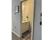 Cozy powder room featuring a neutral color scheme, stylish mirror, and ample cabinet space at 832 Vienna Dr, Winter Haven, FL 33884