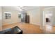 Bright bedroom with parquet floors, natural light, and access to the bathroom at 961 Oleander Se Dr, Winter Haven, FL 33880