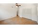 Bright bedroom with a ceiling fan, parquet floors and closet with louvered doors at 961 Oleander Se Dr, Winter Haven, FL 33880